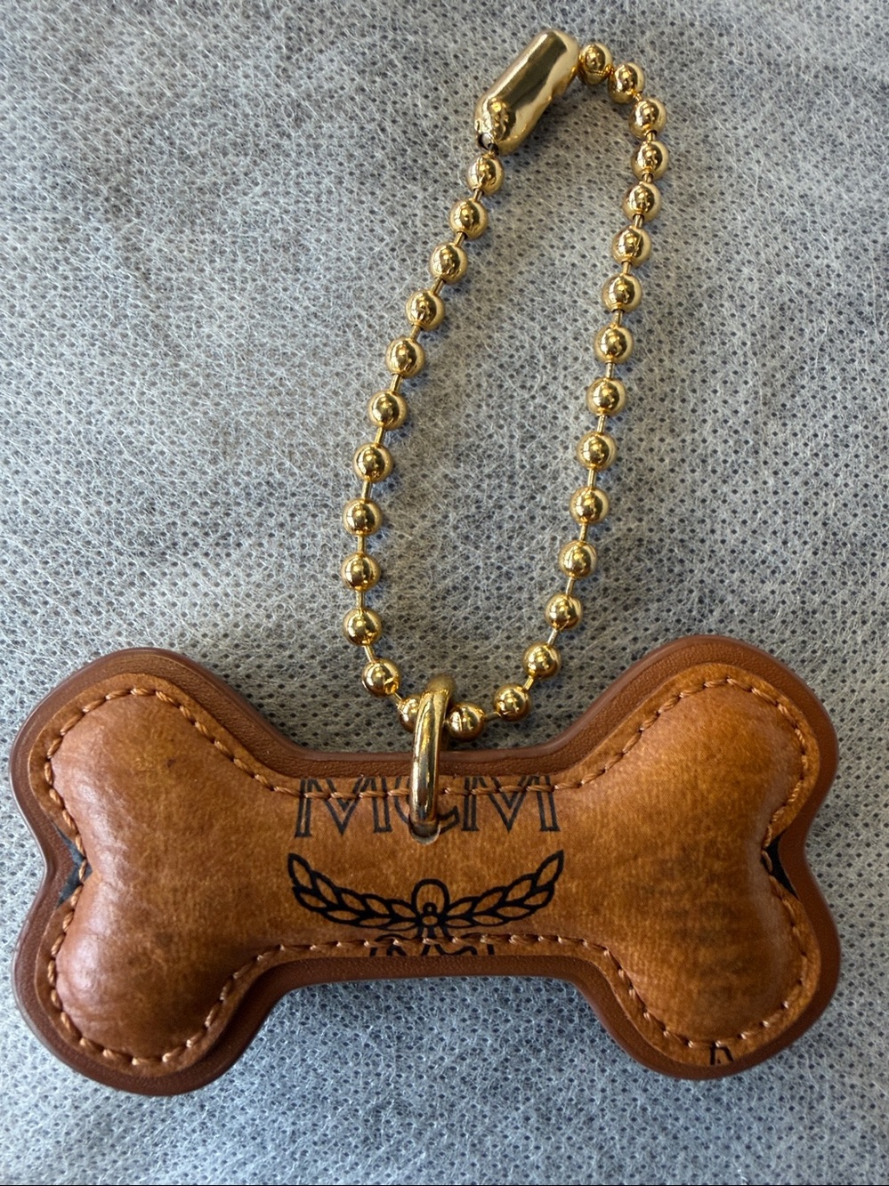 MCM Brown Leather Bone Bag Charm with Gold Chain